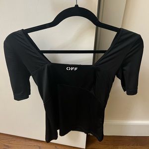 Off white top w an open back